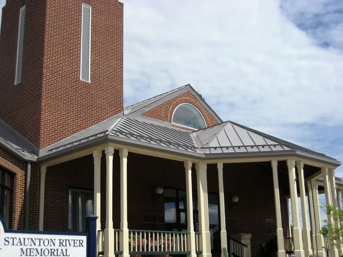 Skilled roofing craftsmen working on a residential roof in Frankfort Center